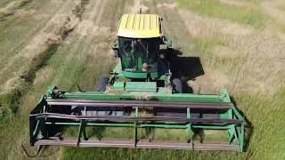 Self propelled 2320 John Deere swathing hay!