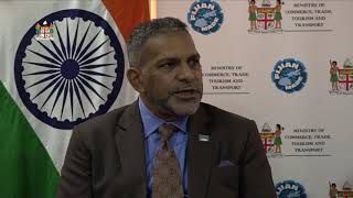 Fijian Minister for Commerce officiates at a cheque handover from the Government of India