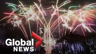 World rings in 2021 with subdued celebrations