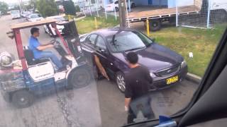 Workers Move a Parked Car With A Forklift out of the way!