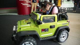 A modified ride-on toy jeep to help a special-needs child learn to drive