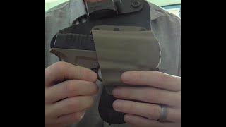 Crossbreed MiniTuck holster review with gun belt, V clips, and J clips for concealment.