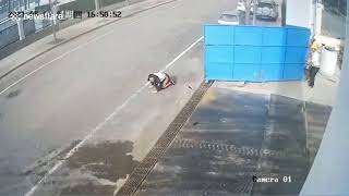 Pedestrian knocked over by iron gate blown open by wind in China