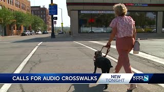 Blind woman calling for audio signals at crosswalks in downtown Des Moines