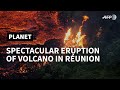Crowds gather at Reunion Island to watch the eruption of a volcano | AFP