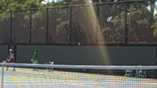 Ayumi Morita practices her two-handed forehand and Ai Sugiyama practices her serve