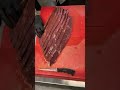 Slicing silverside beef for Biltong