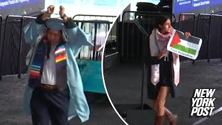 Anti-Israel Columbia grads wear zip ties, rip diplomas on stage during commencem