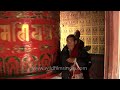 Pilgrims spinning the giant prayer wheel - Boudhanath Temple, Nepal