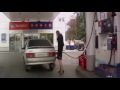 woman failed on multitasking at the gas station