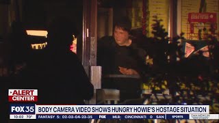 Body cameras show new images of suspect in Hungry Howie's hostage situation