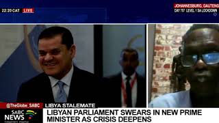 Libyan parliament swears in new Prime Minister as crisis deepens