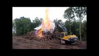 Excavator Stacking Brush Fire