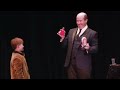 stuart macdonald performs showbiz. a hilarious trick with a kid s shoe from the audience.