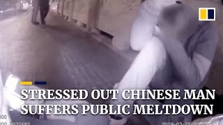 Stressed out Chinese man suffers emotional meltdown in public