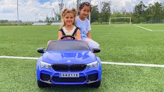 Cuties driving Voltztoys BMW M5 with ride-on car with leather seat and remote