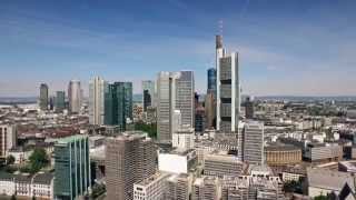 Scanclimber SC8000 mast climber cladding the 148 m Eurotower skyscraper in Frankfurt, Germany