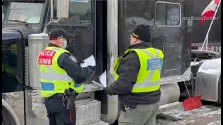 Ottawa police hand out notices to protesters telling them leave the area or face criminal charges