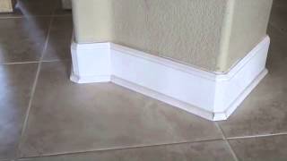 Does baseboard get installed before or after a tile floor?