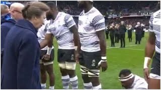 Princess Anne appears confused as Fiji player drops to ground while she meets team - video