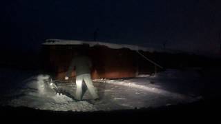 Snow removal at the garage with shovel