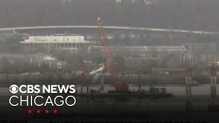 Salvage crews remove wreckage of plane and helicopter from Potomac River