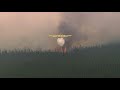 Ontario Ministry of Natural Resources CL 415 waterbomber tanker drop on forest fire