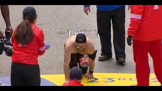 Marine crawls across Boston Marathon finish line to honor fallen comrades