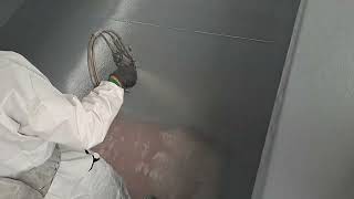 Applying Mapei Purtop 1000N polyurea to steel pressure test tank in Hampshire