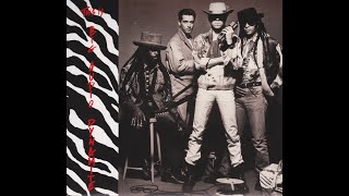 Big Audio Dynamite - The Bottom Line (Lyrics)