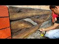 cement wall . painting into wood design.