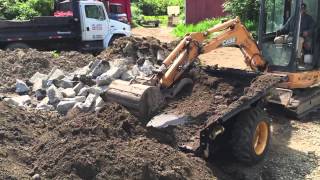 Unloading the DeSite ASM Excavator material transport bin 1