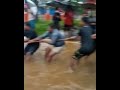 ksrtc bus stuck in flooded water in poonjar kottayam. people drags the bus to shore with ropes.