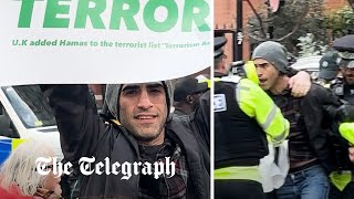 Counter-protester arrested shortly after revealing 'Hamas is terrorist' placard in London