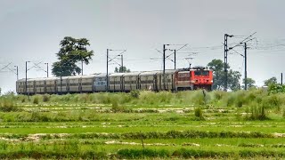 Scenic View of A High-speed Train : Malda - Digha Express Furiously Passes Through A Village