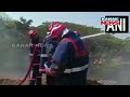 fire breaks out at chelora trenching ground in kannur fire tenders at spot fire doused