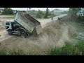 best technique. processing use dump trucks with mitsubishi dozer pouring land to fill flooded soil