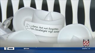 Families share grief at candlelight vigil