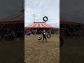 circus strongman tires juggling