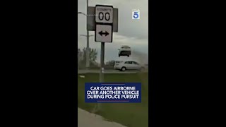 Car goes airborne over another vehicle during police pursuit