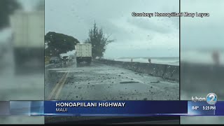 Waves crash onto Honoapiilani Highway from high surf and high tides