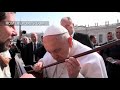 Pope Francis kisses the cane of St. Teresa of Avila to celebrate her fifth centenary