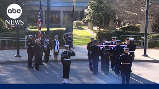 Motorcade arrives at the Jimmy Carter Presidential Library for state funeral