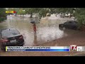 Laura Smith checks out flooding on Atlantic Avenue in Raleigh