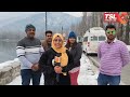 kashmir s freezed dal lake attracts tourists listen what they are saying