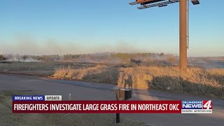 Firefighters investigate large grass fire