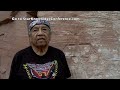 native american zuni elder clifford mahooty shows ancient petroglyphs