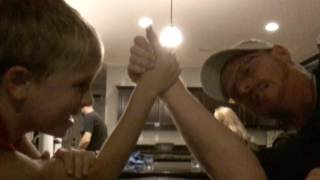 Dad barely beats son at arm wrestling