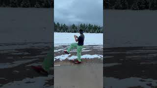 Baseball player throwing a snowball