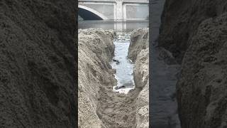 River Dam Breaks And Flows Into Ocean